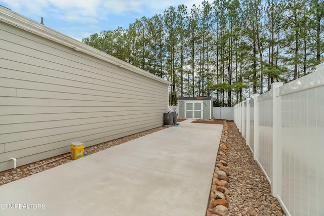 view of patio / terrace with a shed