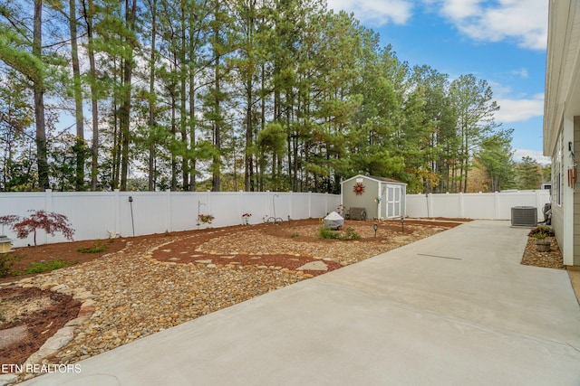 view of patio with a storage shed and central AC