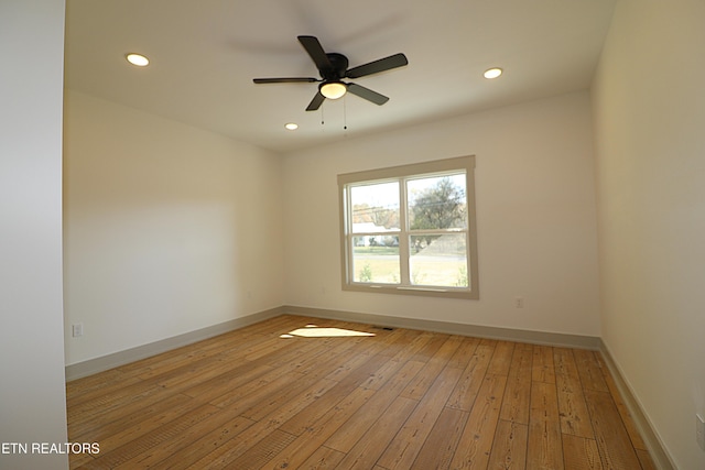 unfurnished room featuring recessed lighting, baseboards, a ceiling fan, and light wood finished floors