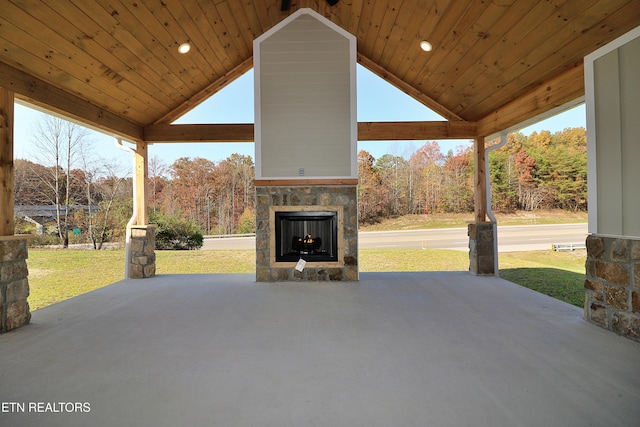 view of patio with an outdoor stone fireplace