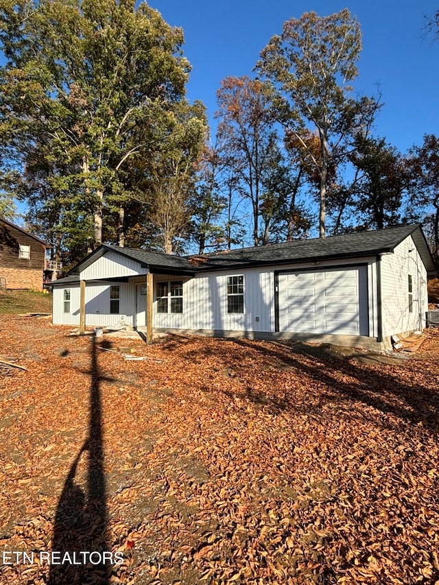 ranch-style house featuring a garage