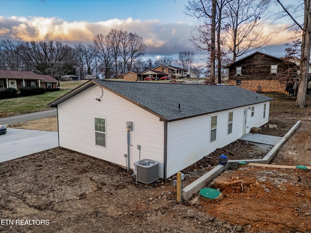 property exterior at dusk with central AC