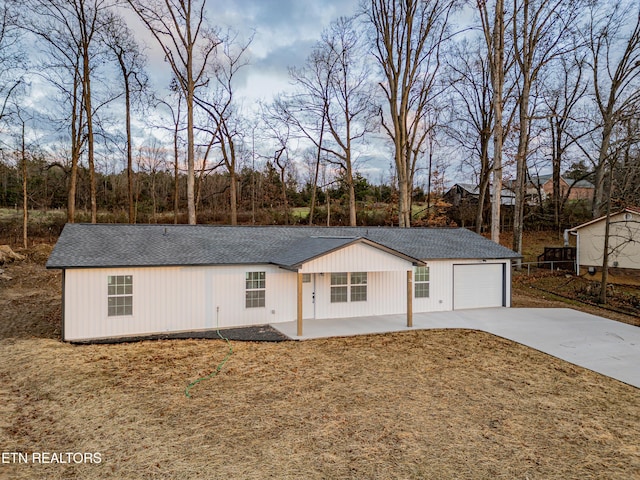 view of front of property with a porch and a garage