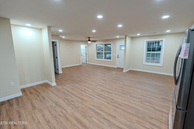 interior space with ceiling fan and light wood-type flooring