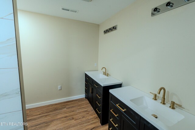 bathroom featuring vanity and hardwood / wood-style flooring