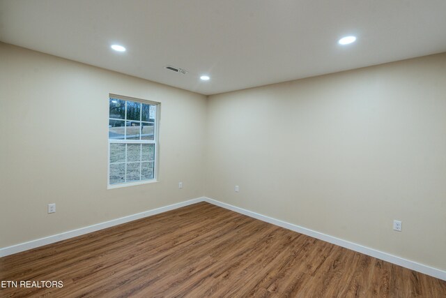 unfurnished room featuring hardwood / wood-style floors