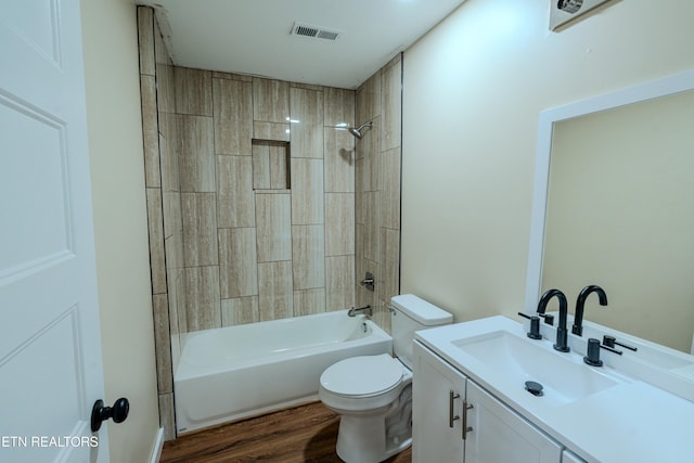 full bathroom featuring hardwood / wood-style flooring, vanity, toilet, and washtub / shower combination