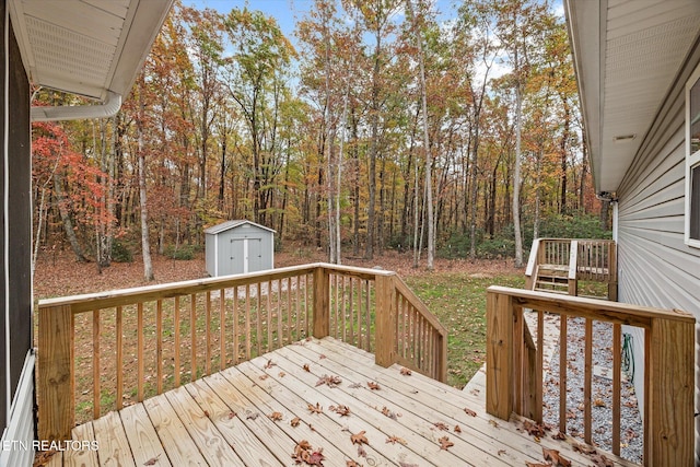 wooden terrace featuring a storage unit