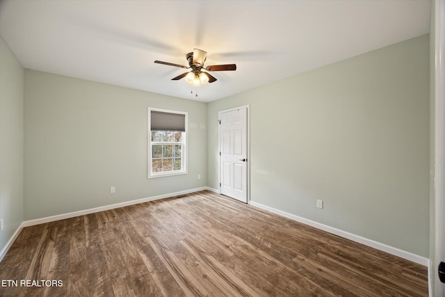 unfurnished room with ceiling fan and hardwood / wood-style floors