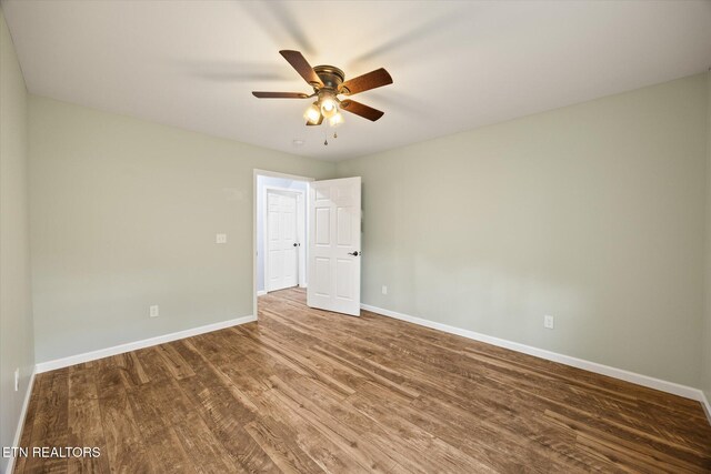 unfurnished room featuring ceiling fan and wood-type flooring