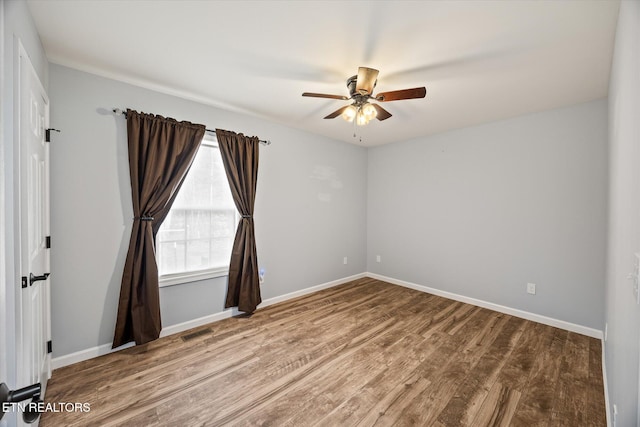 unfurnished room with wood-type flooring and ceiling fan