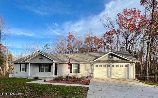 ranch-style home featuring a garage