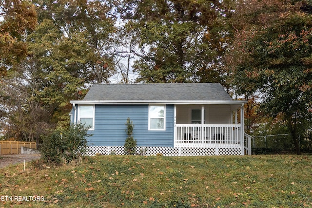 view of property exterior featuring a yard and a porch