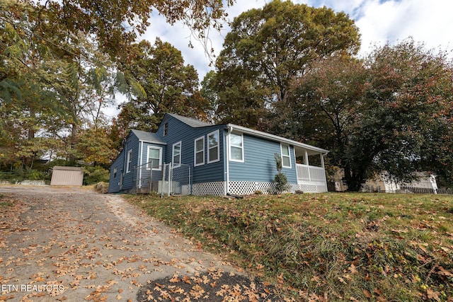 view of front of home with a storage unit