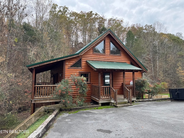 cabin featuring covered porch