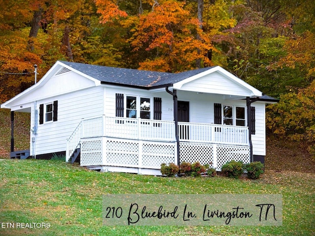 single story home featuring a front yard and covered porch