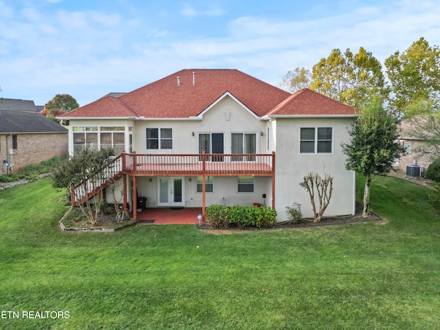 rear view of house featuring central AC, a yard, and a patio area