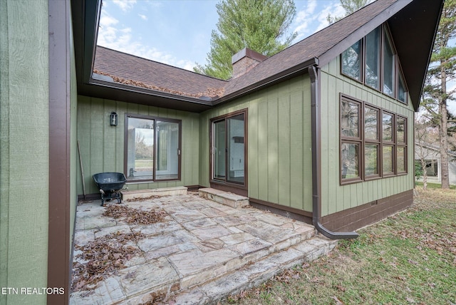 back of property with a patio