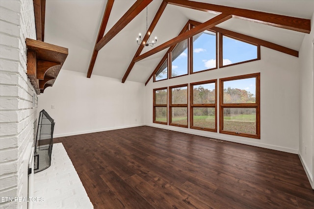 unfurnished living room with dark wood-type flooring, high vaulted ceiling, beamed ceiling, and an inviting chandelier