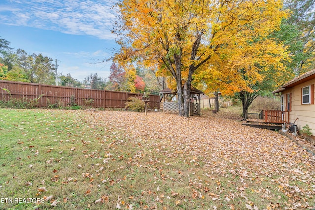 view of yard featuring a gazebo and a deck