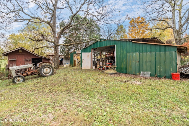 view of outdoor structure featuring a lawn