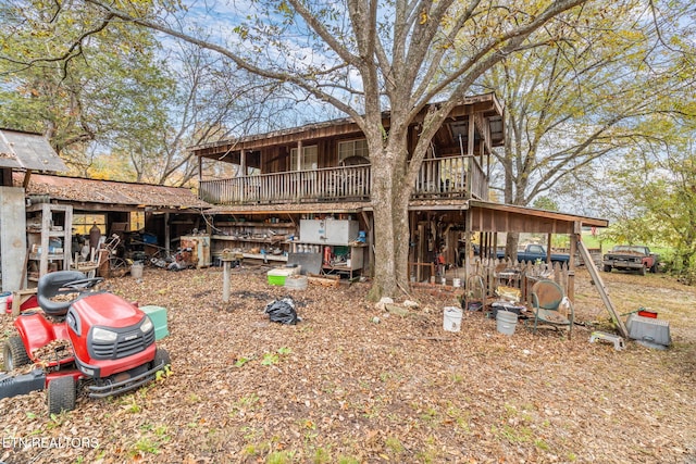 back of property featuring a wooden deck