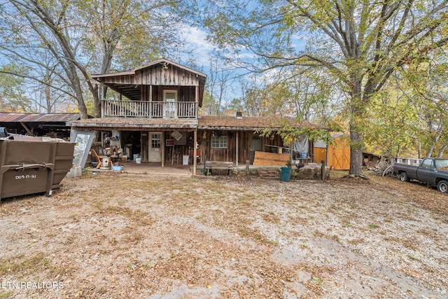 back of property with a patio