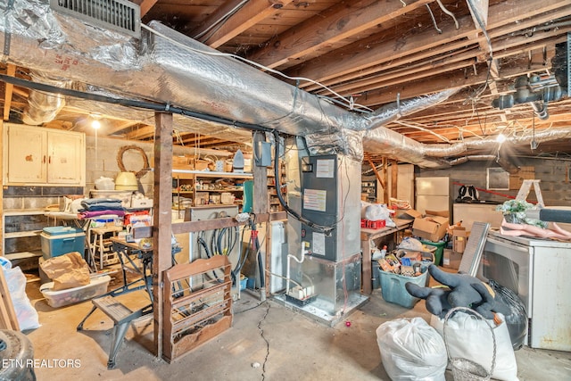 basement featuring heating unit