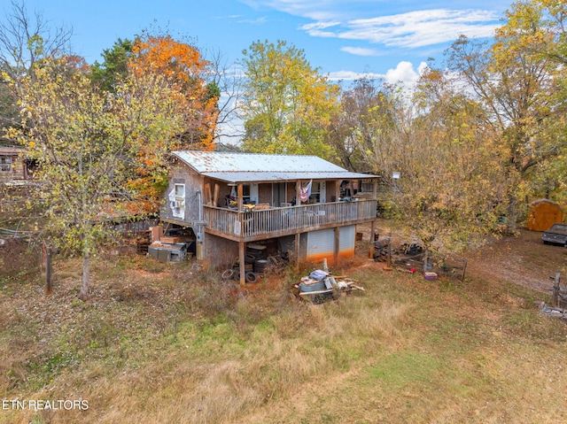 back of property featuring a deck