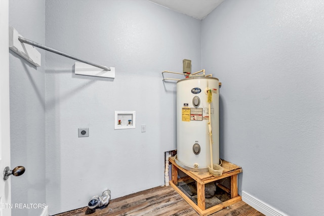 laundry room with hookup for a washing machine, electric water heater, electric dryer hookup, and hardwood / wood-style flooring