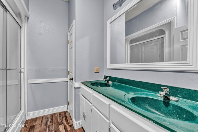 bathroom with vanity and wood-type flooring