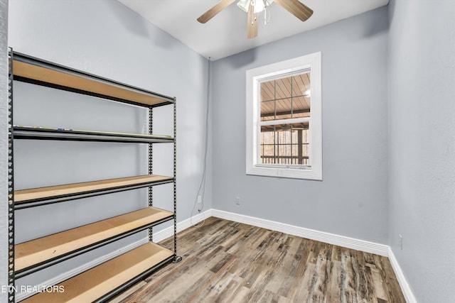 spare room with ceiling fan and hardwood / wood-style floors