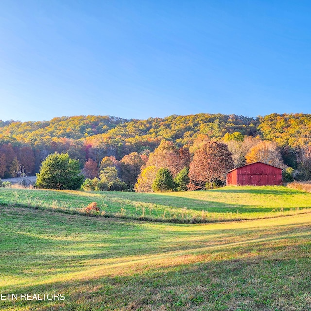 property view of mountains featuring a rural view