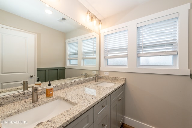 bathroom with vanity and a healthy amount of sunlight