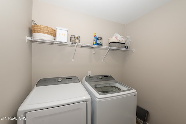 washroom with washer and clothes dryer