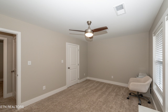 unfurnished room featuring ceiling fan and light colored carpet