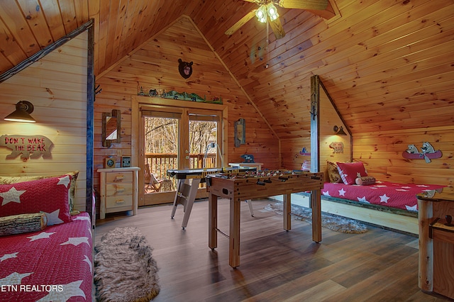 recreation room featuring wood walls, wood-type flooring, vaulted ceiling, and wooden ceiling