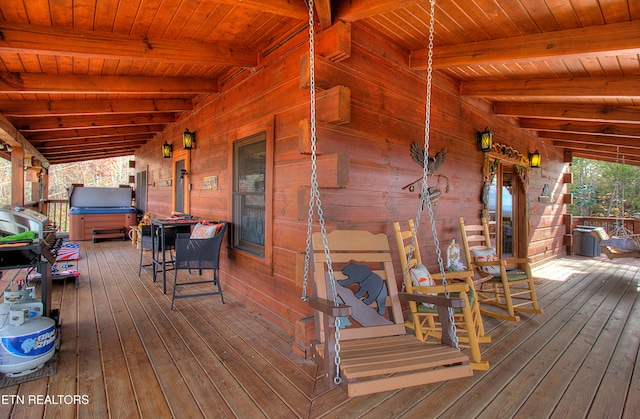 deck featuring a hot tub