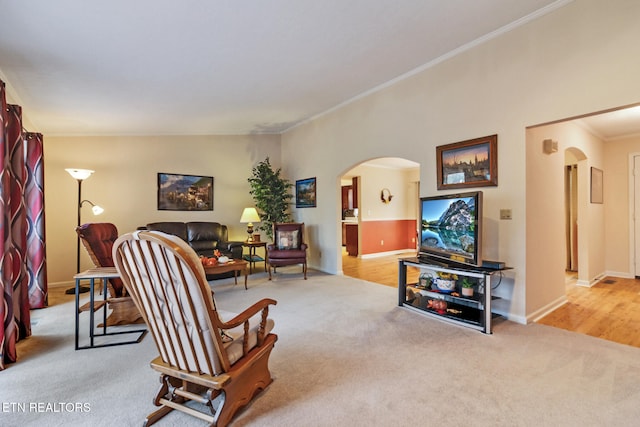 living room with light carpet, lofted ceiling, and ornamental molding