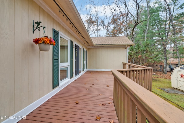 deck featuring a shed