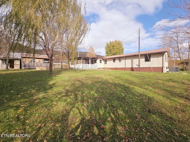 view of yard featuring central AC unit