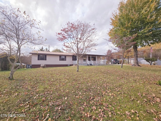 exterior space featuring a yard and covered porch