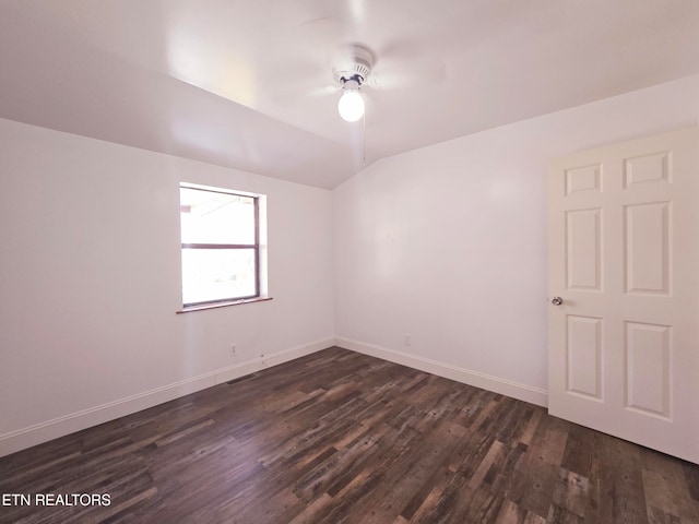 spare room featuring ceiling fan and dark hardwood / wood-style flooring