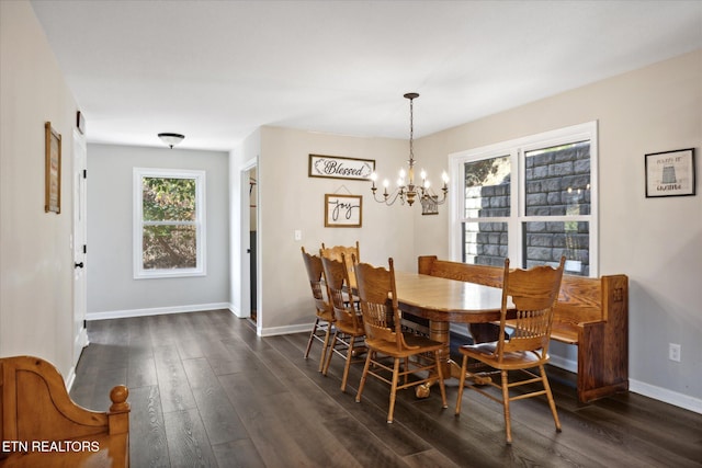 dining area featuring a chandelier and dark hardwood / wood-style flooring