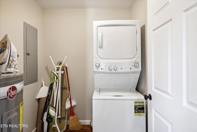 clothes washing area with electric panel, stacked washer / drying machine, and electric water heater