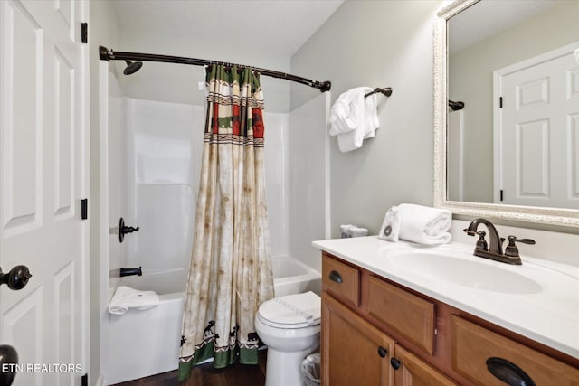 full bathroom with vanity, shower / tub combo with curtain, hardwood / wood-style flooring, and toilet