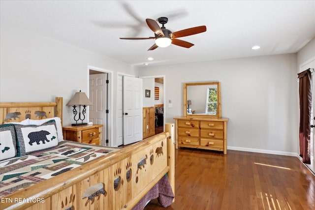 bedroom with dark hardwood / wood-style flooring and ceiling fan