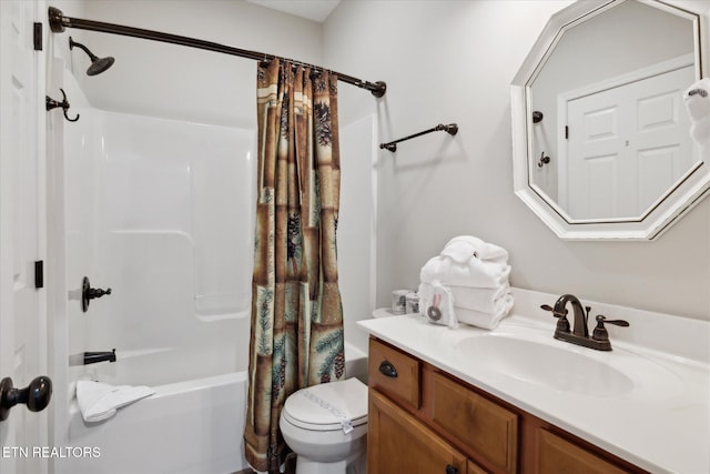 full bathroom with vanity, toilet, and shower / tub combo