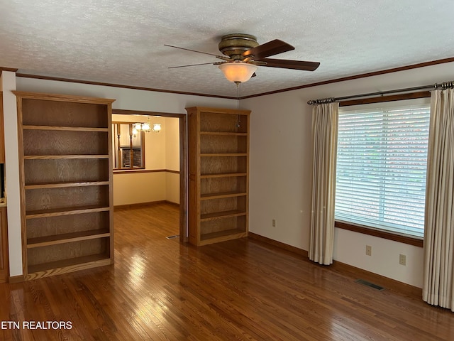 interior space featuring ornamental molding, a textured ceiling, dark hardwood / wood-style floors, and ceiling fan