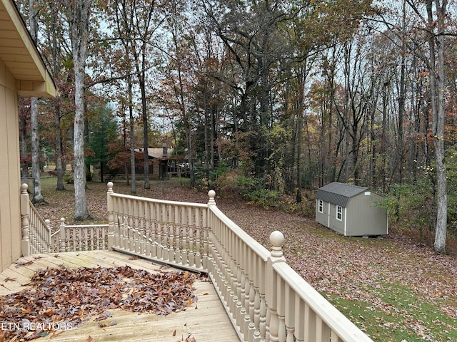 exterior space featuring a storage shed and a deck